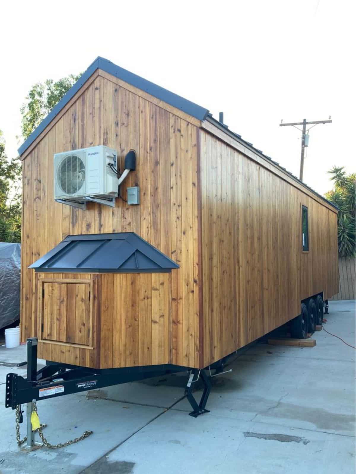 Stunning brown hardwood exterior of 30' Durable Tiny Home