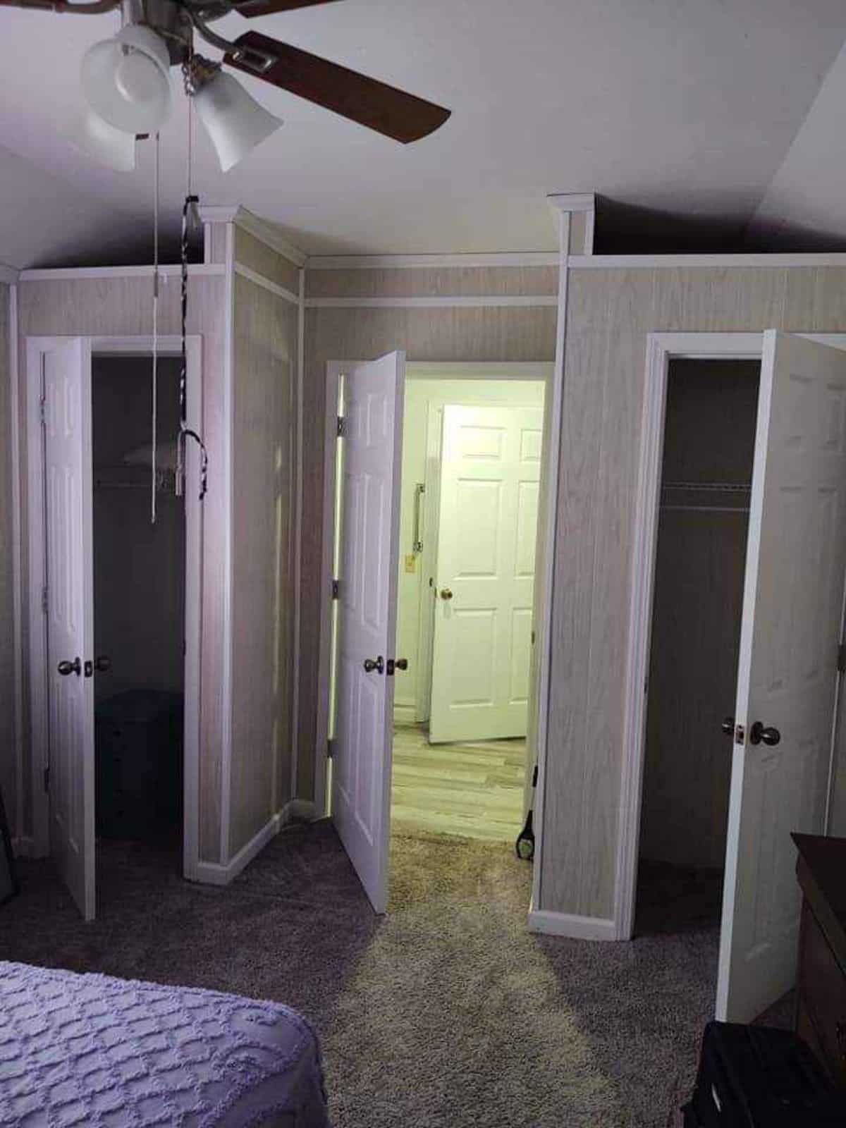 Bedroom of 40’ Tiny House also has a closet, dressing table  and storage