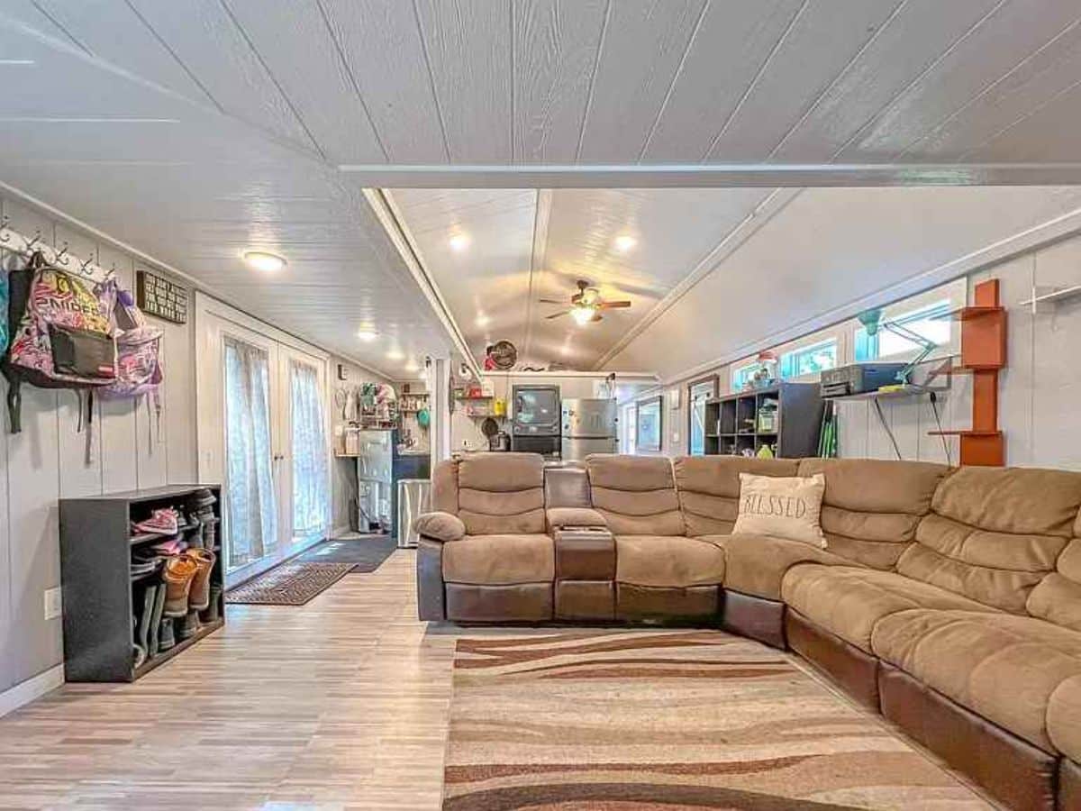 Super comfortable L shaped massive couch in living area of Blissful tiny home