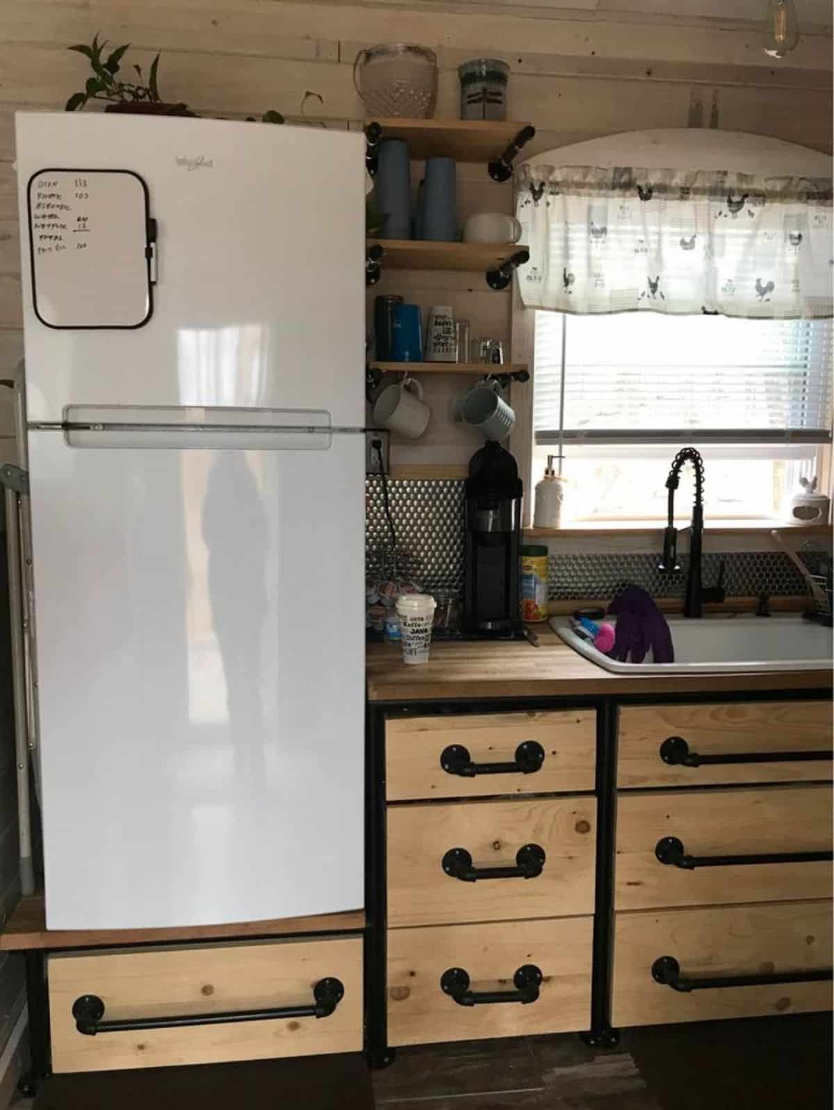 Double door refrigerator is also included in the kitchen
