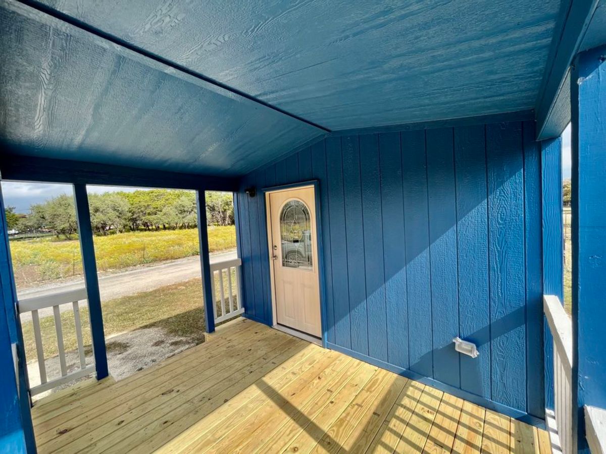 Huge porch outside the main entrance of 1 Bedroom Tiny House Comes