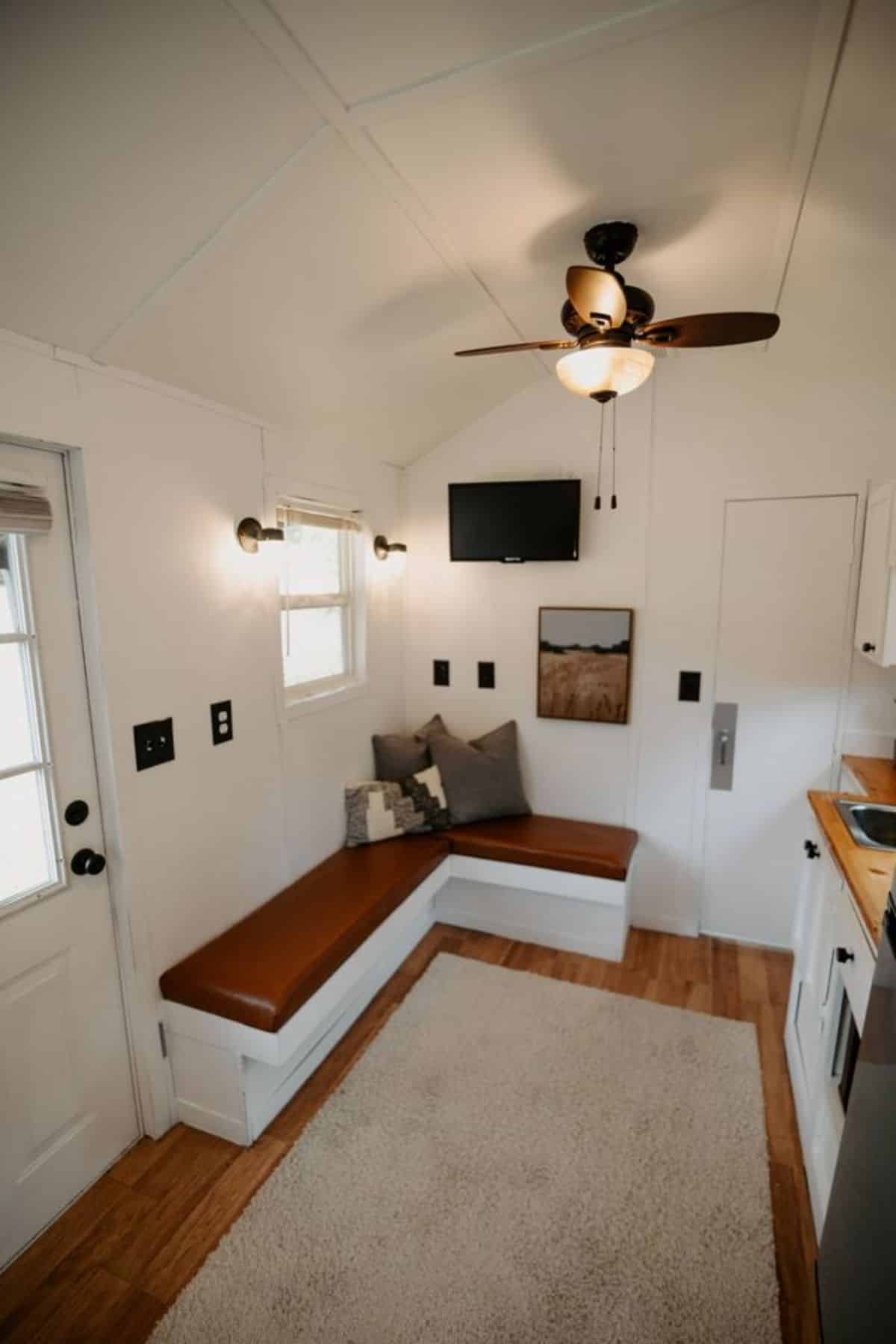 L shaped living area of 21' Minimalistic Tiny House
