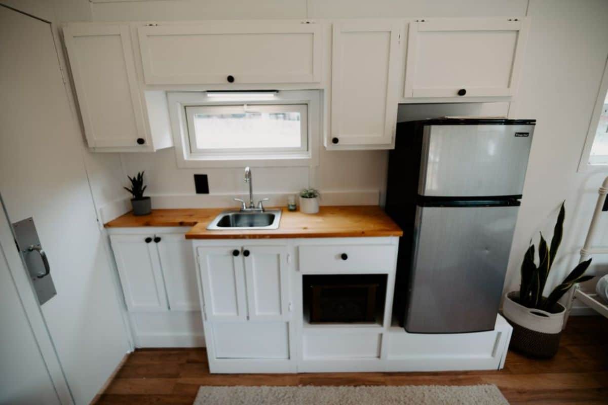 Compact but well organized kitchen area of 21' Minimalistic Tiny House
