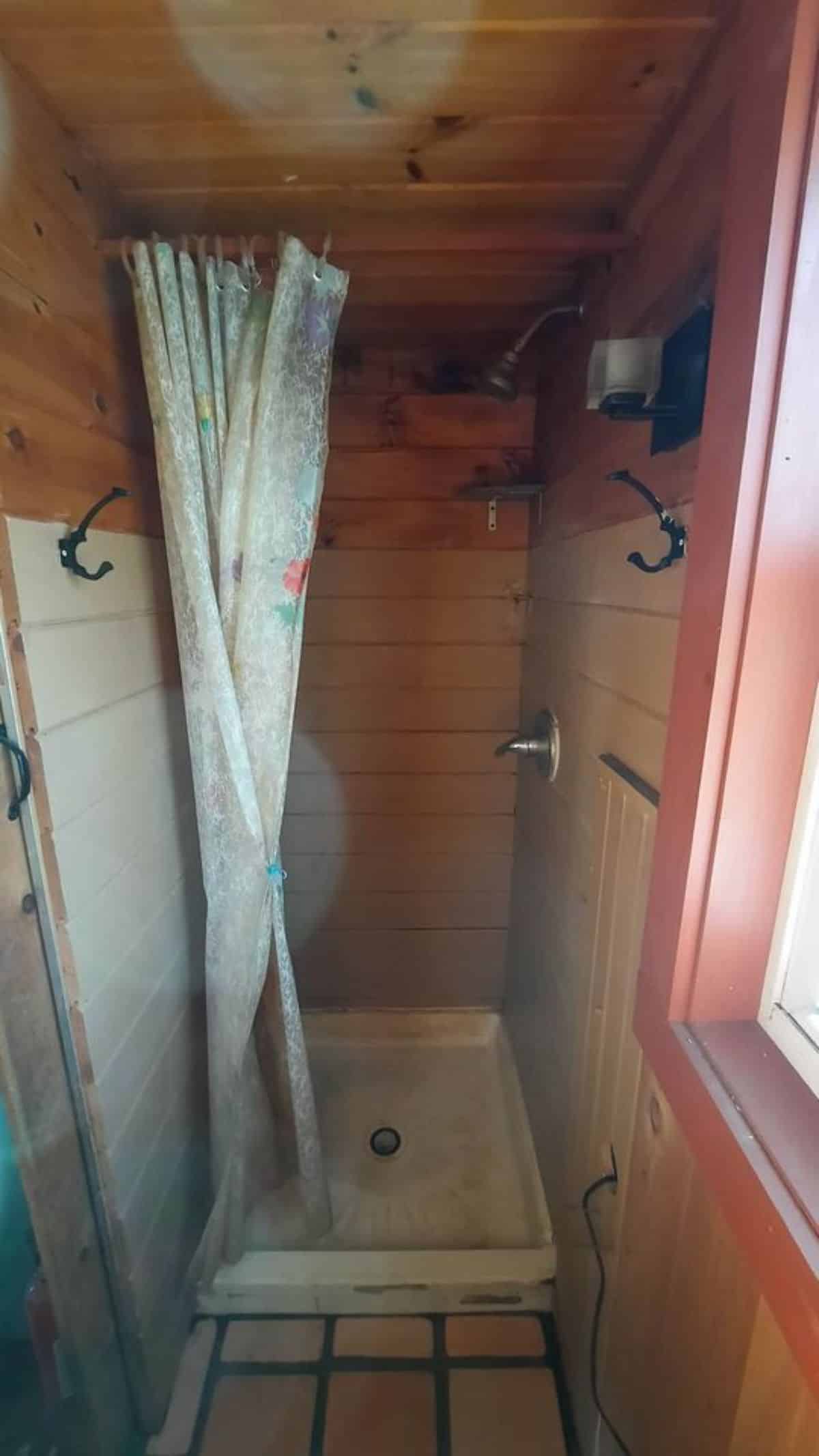 Bathroom has a compost toilet and separate shower area