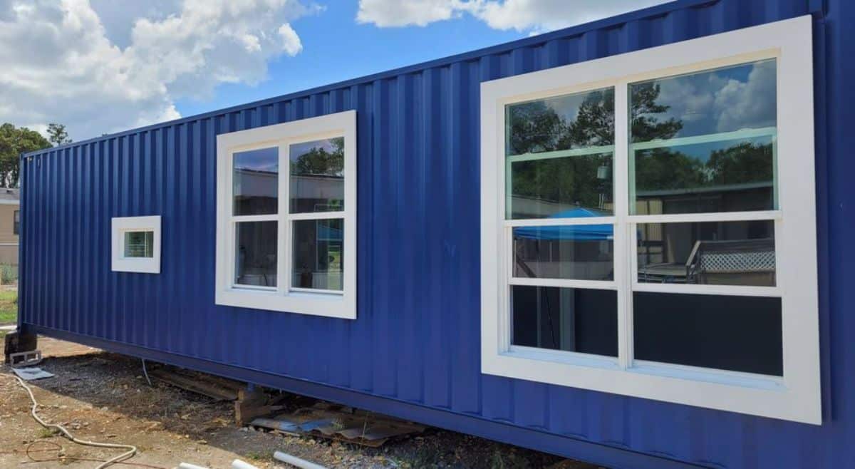 Stunning blue exterior of 320 sf tiny home