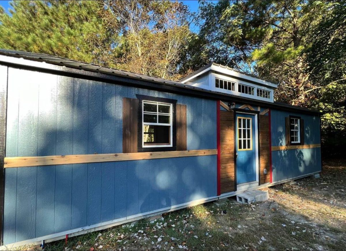 Blue rustic exterior of Affordable Tiny Home