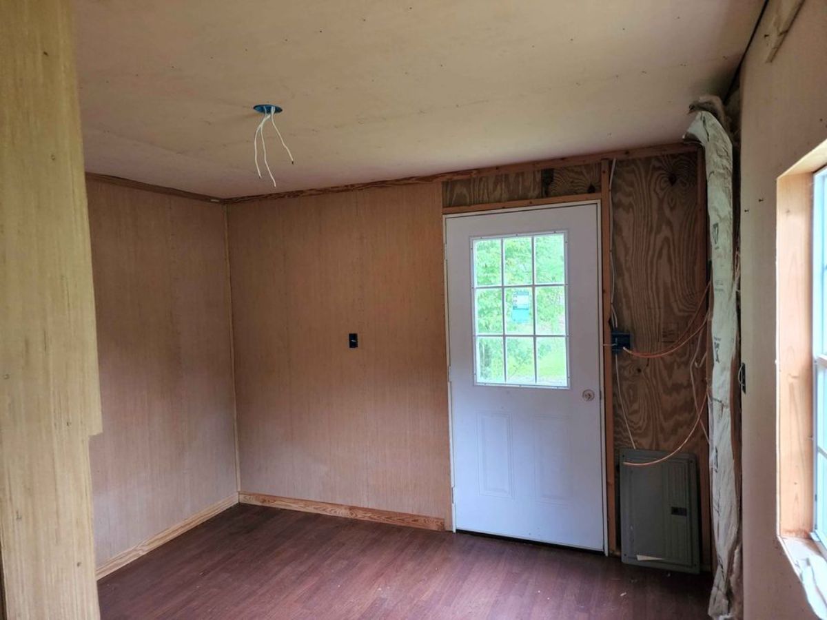 Separate bedroom area of budget tiny house