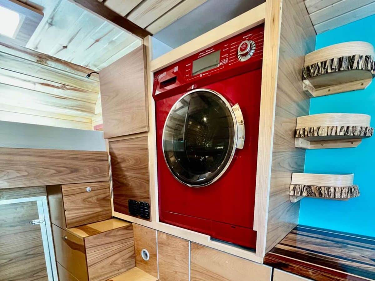Huge washer dryer combo in the storage cabinets