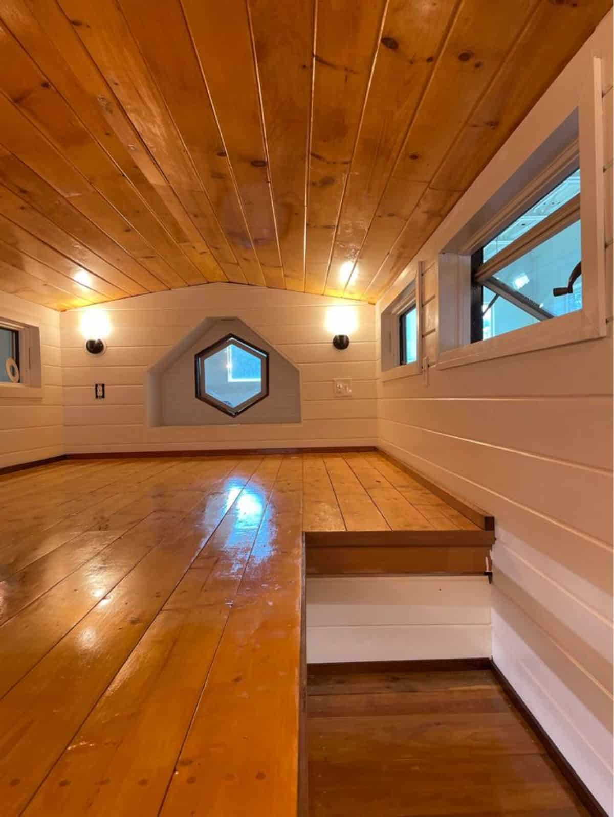 handmade hex window on one side makes the loft more bright