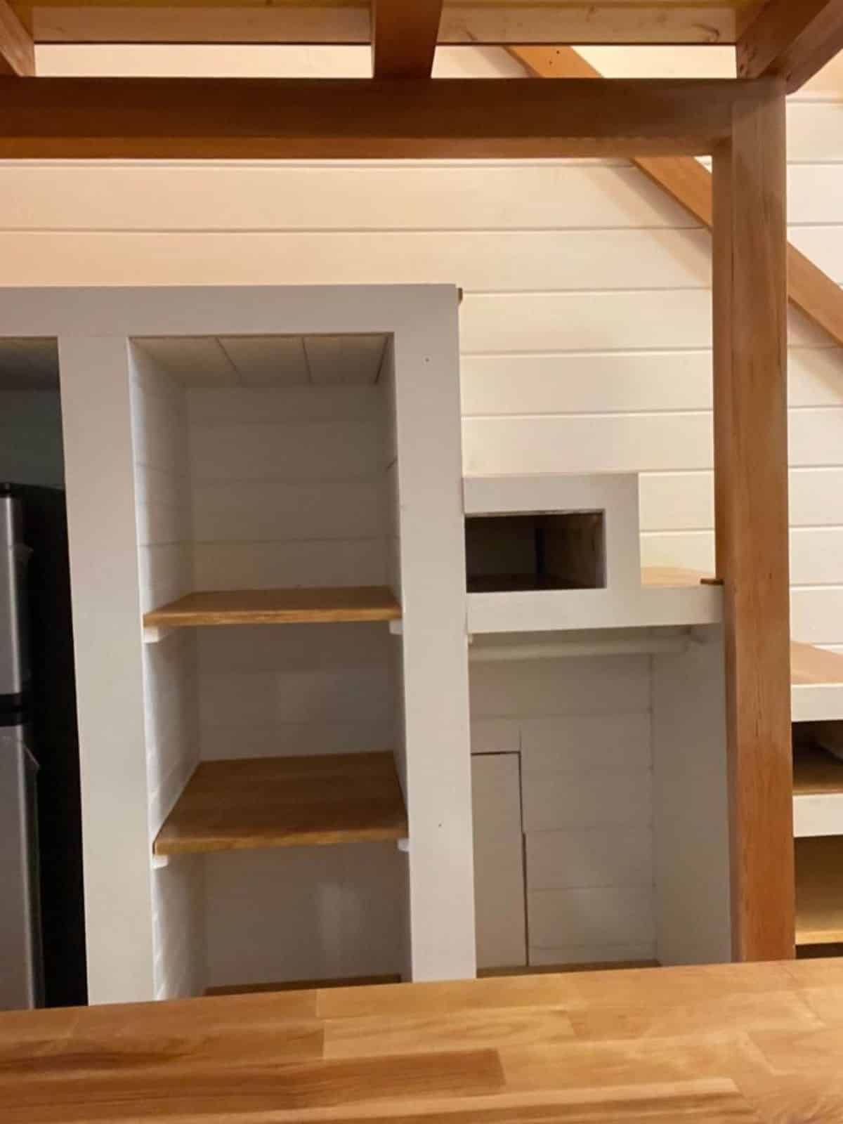 Storage cabinets underneath the stairs