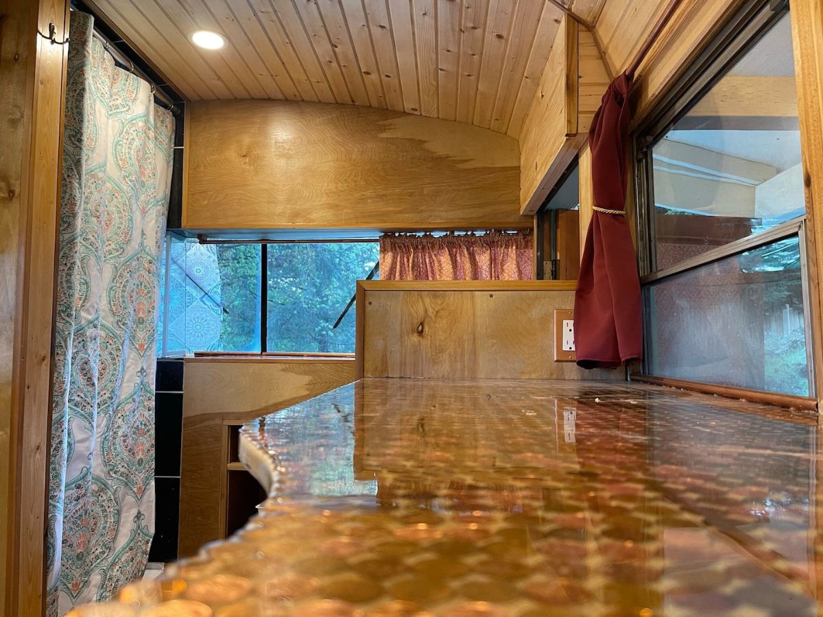 countertop with window on right and front of bus in background
