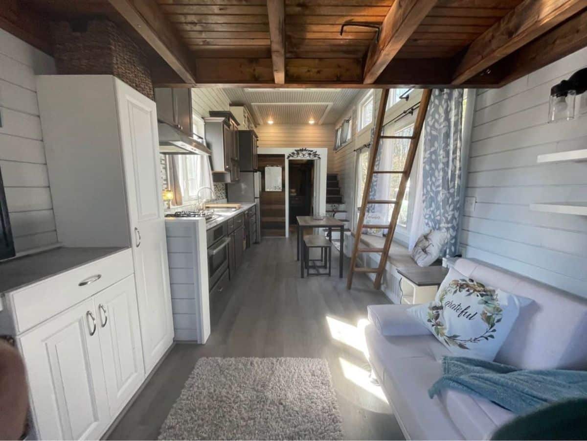 Stunning interiors of 2 bedroom tiny home from living room view