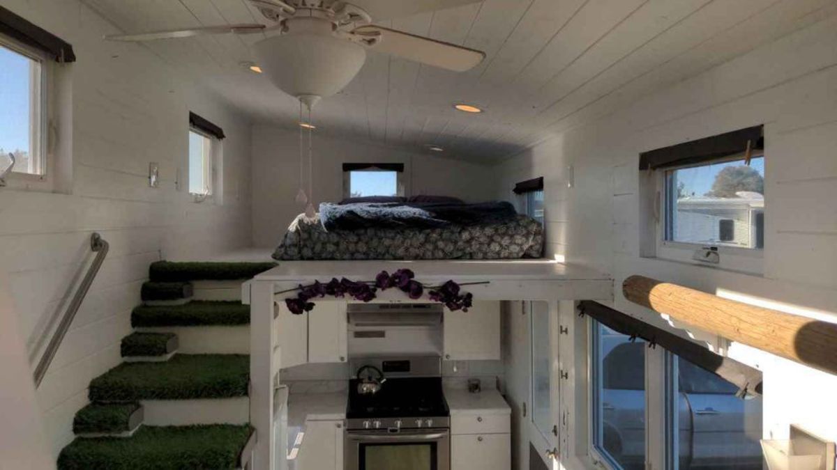 Loft bedroom has a comfortable bed and still left with ample space accessible through stairs