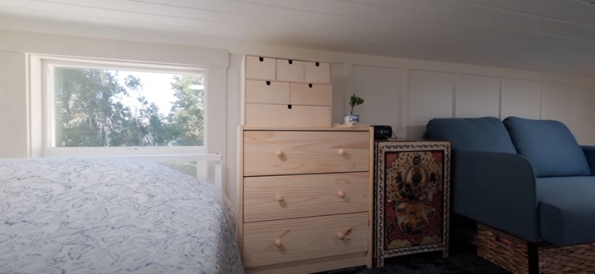 small chest of drawers against wall of loft