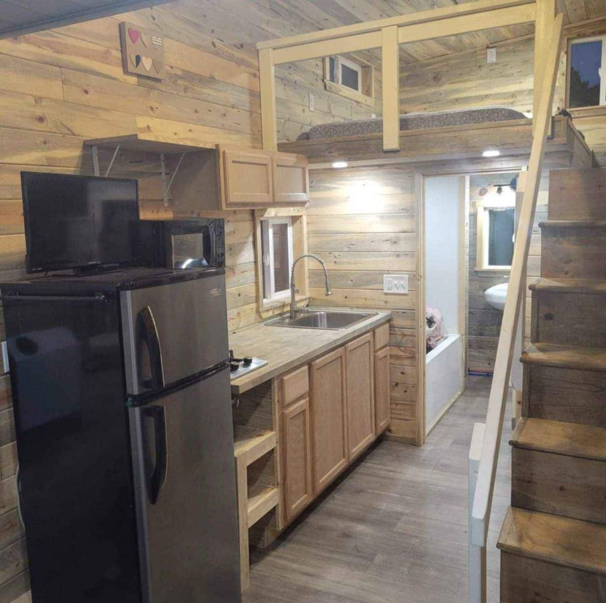 Kitchen area of 20’ tiny house with two lofts