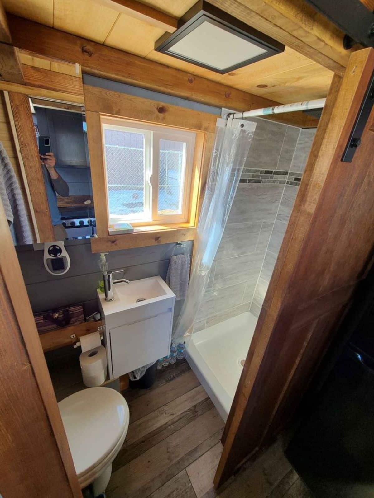 Bathroom has composting toilet, sink with vanity