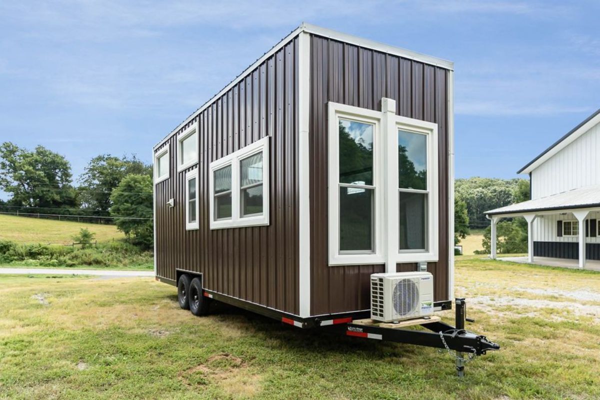 Huge windows from outside of this brand new tiny house