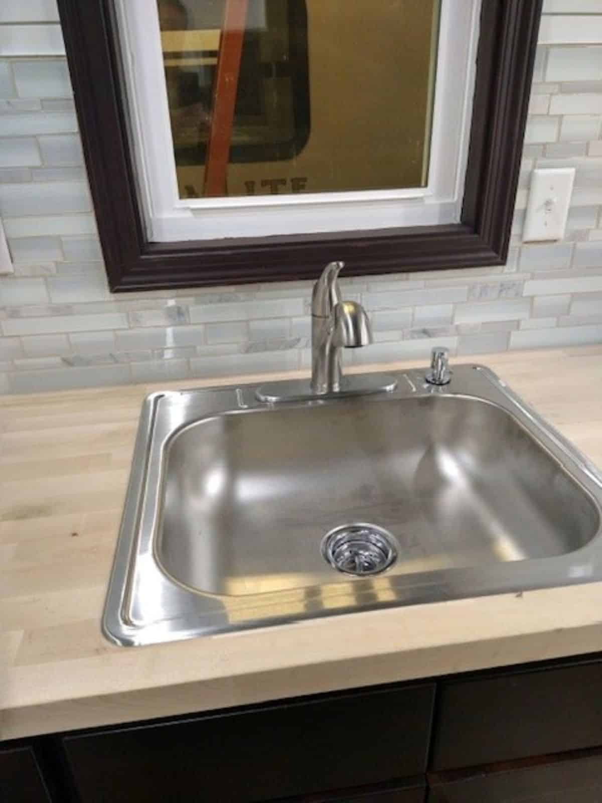 Stainless steel sink in bathroom