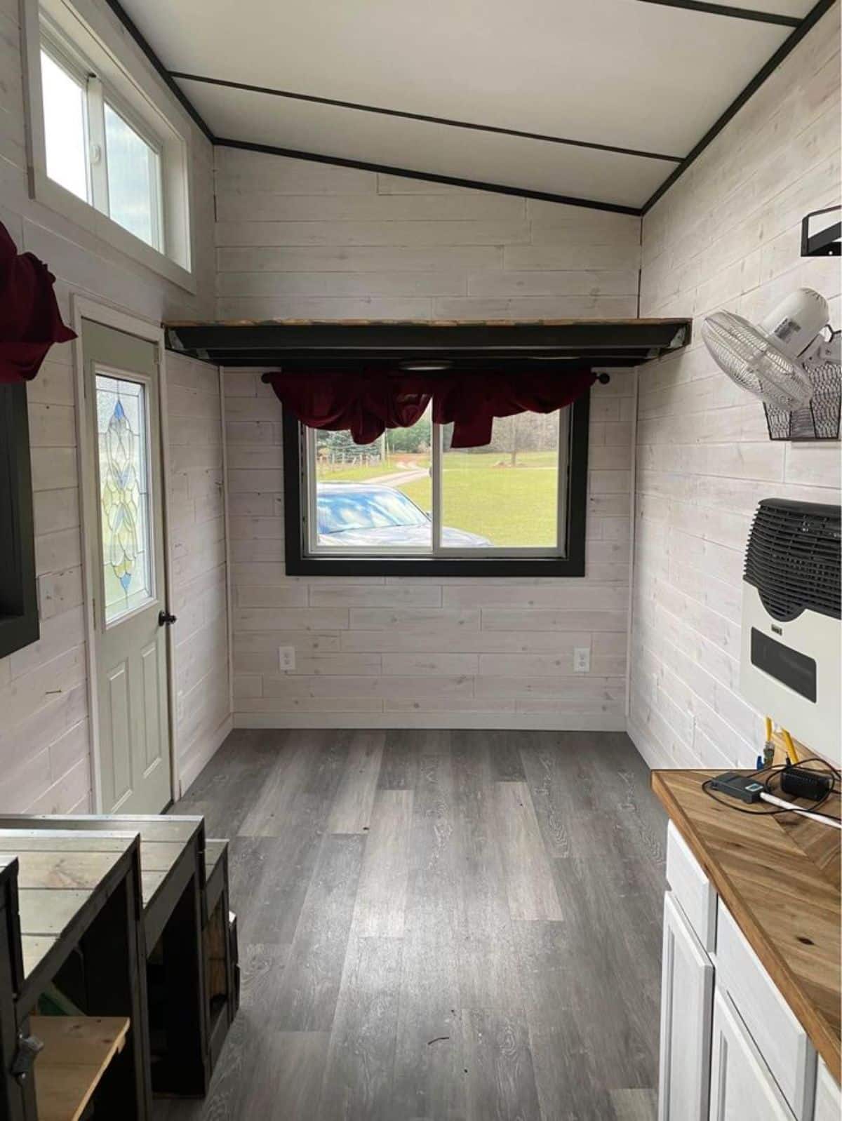 Living area and small loft of 24' Cozy Tiny House