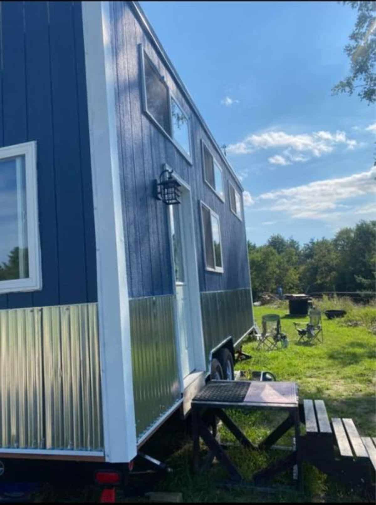 Rustic blue and silver paint exterior of 24' Cozy Tiny House