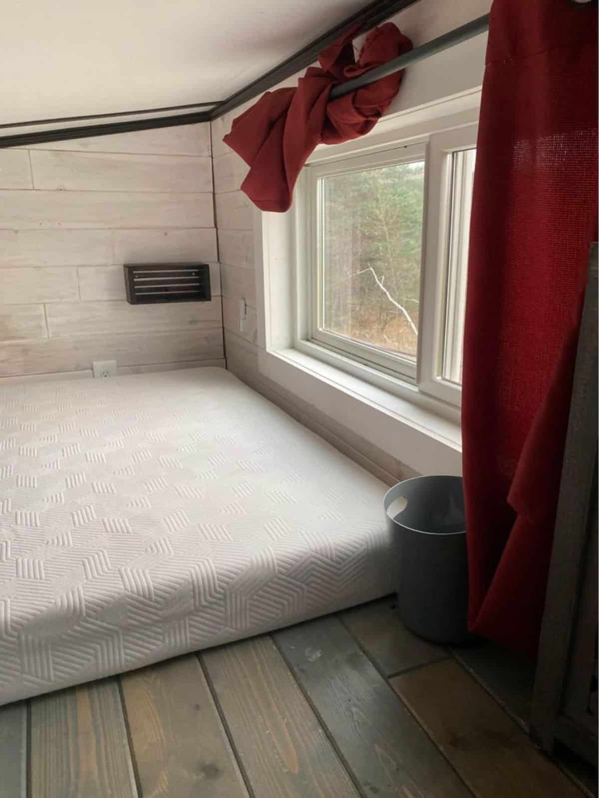 Loft bedroom has a huge window