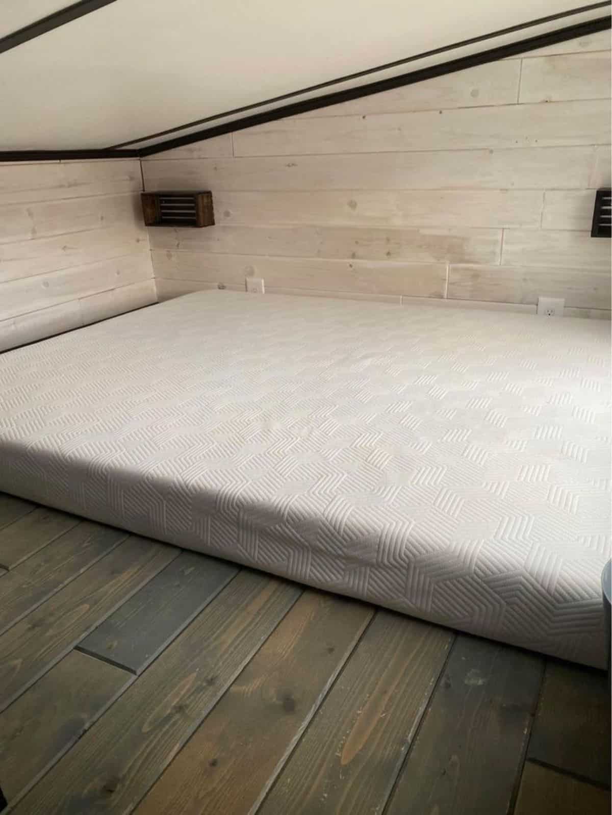 Loft bedroom has a queen mattress