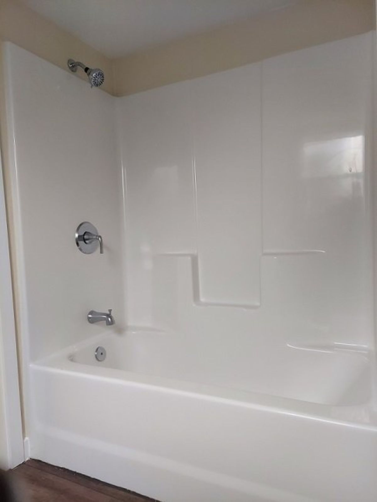 Shower and bathtub in bathroom of 24’ tiny house on wheels