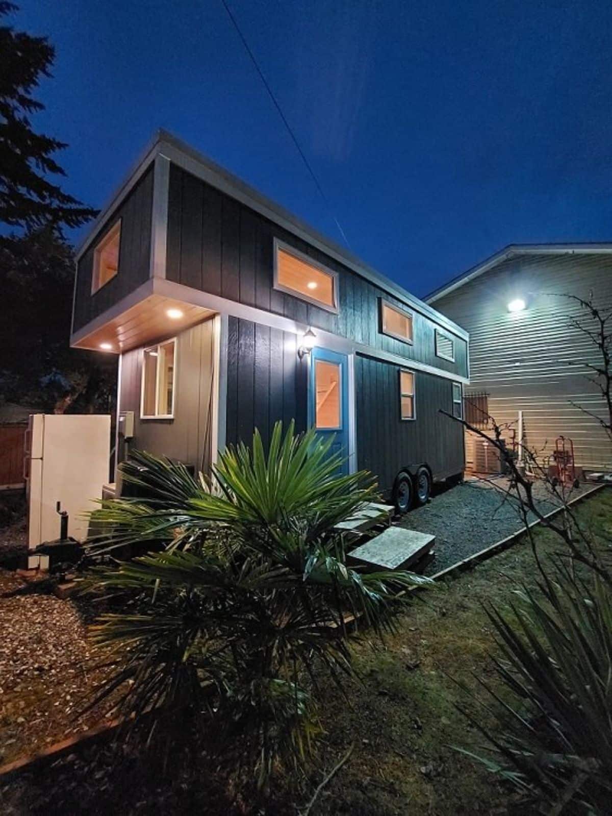Main entrance view of 24’ tiny house on wheels
