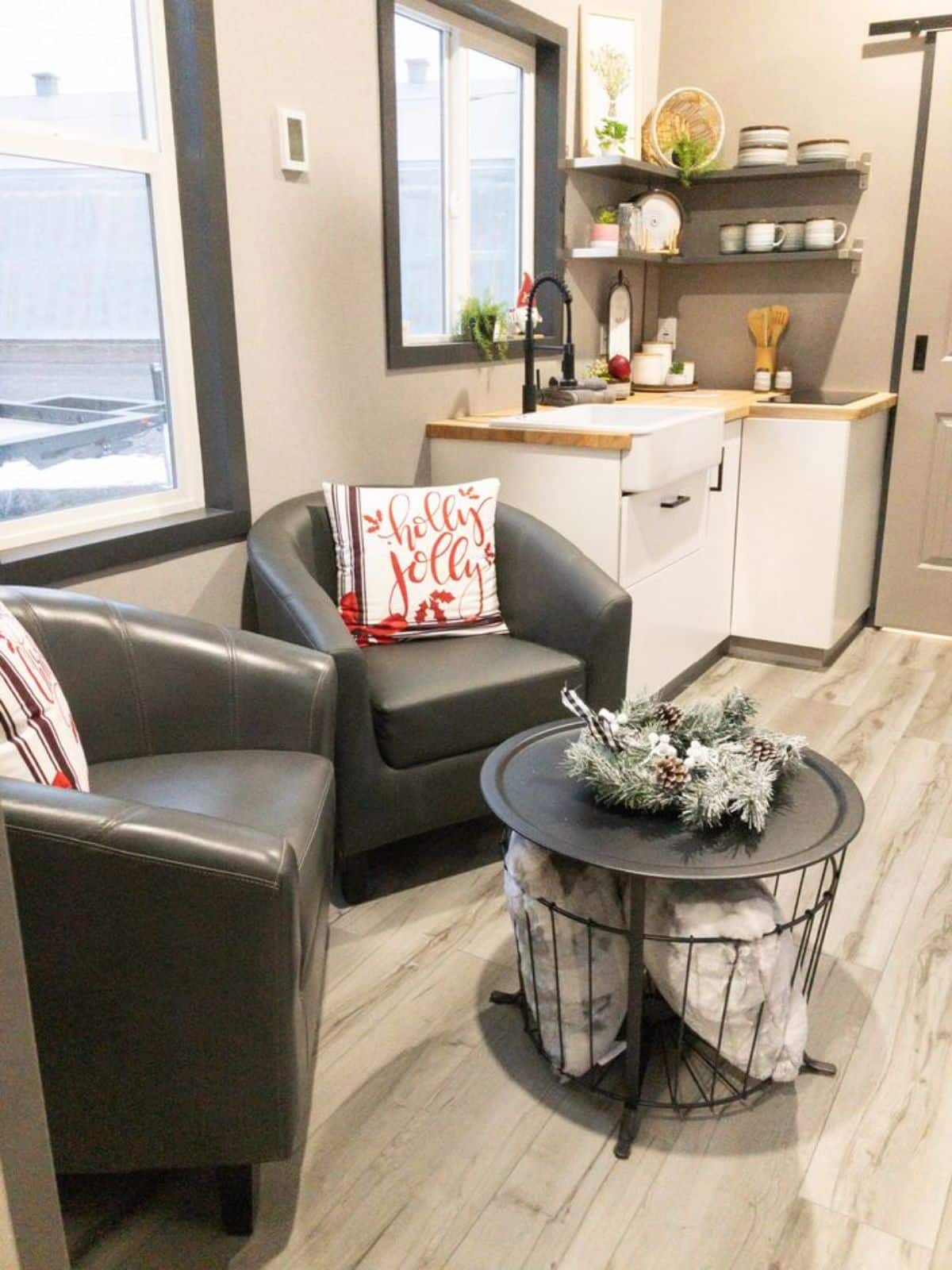 2 sofa chairs and center table in living area of Luxurious & Stunning Tiny Home
