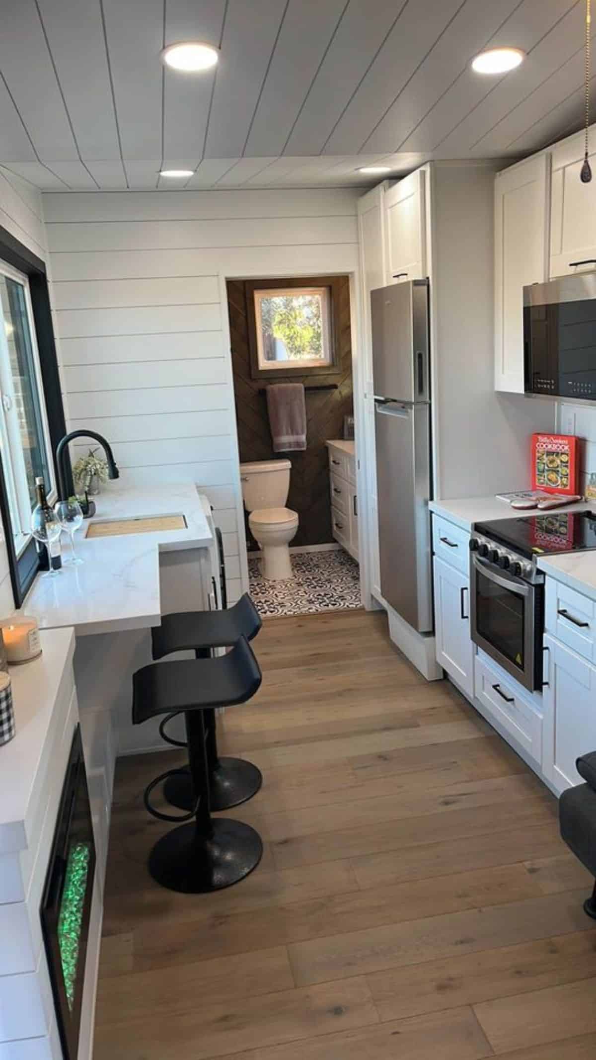 Stylish wooden interiors of 28’ park model tiny home