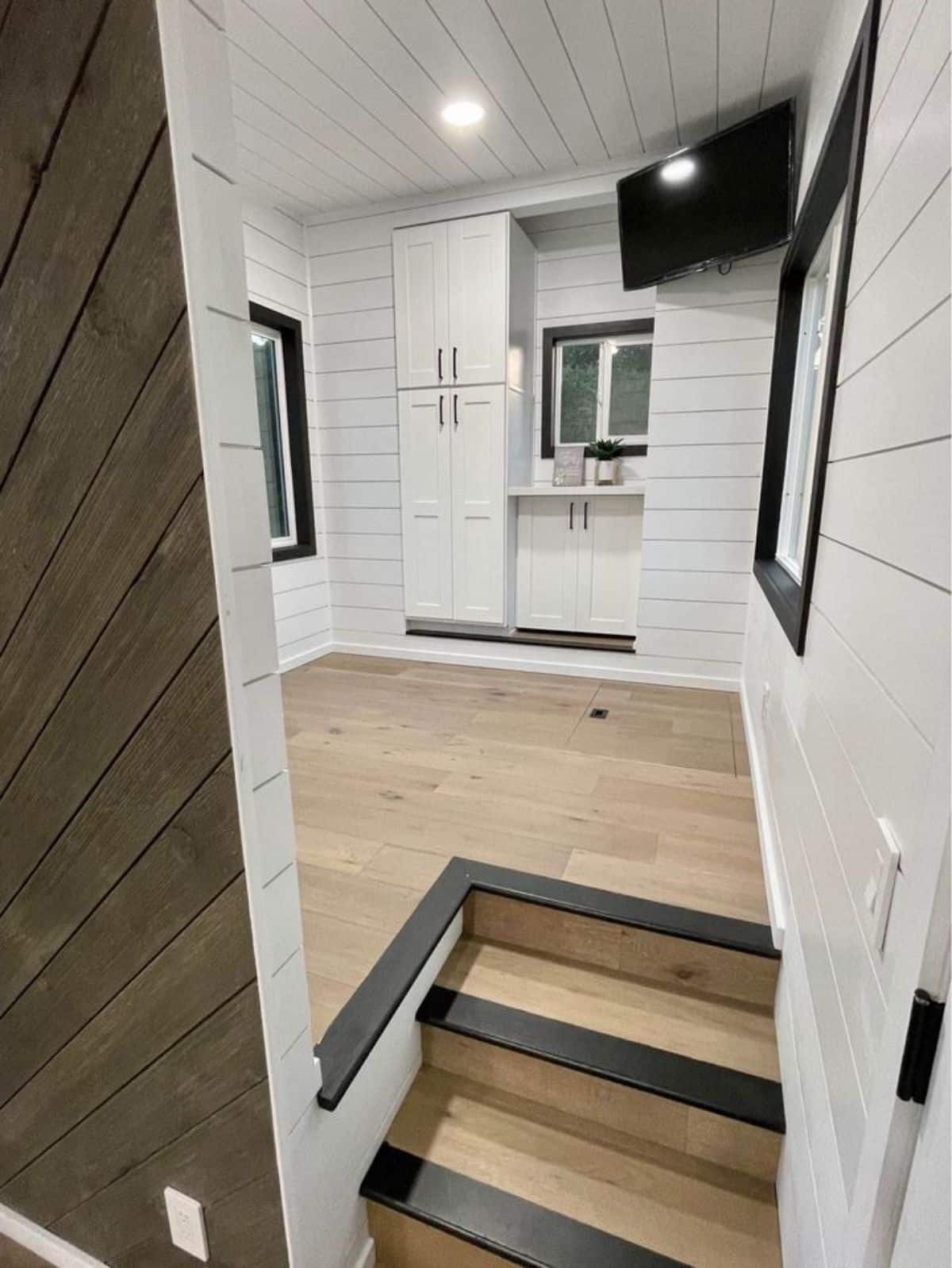 Stunning bedroom area of 28’ park model tiny home is spacious