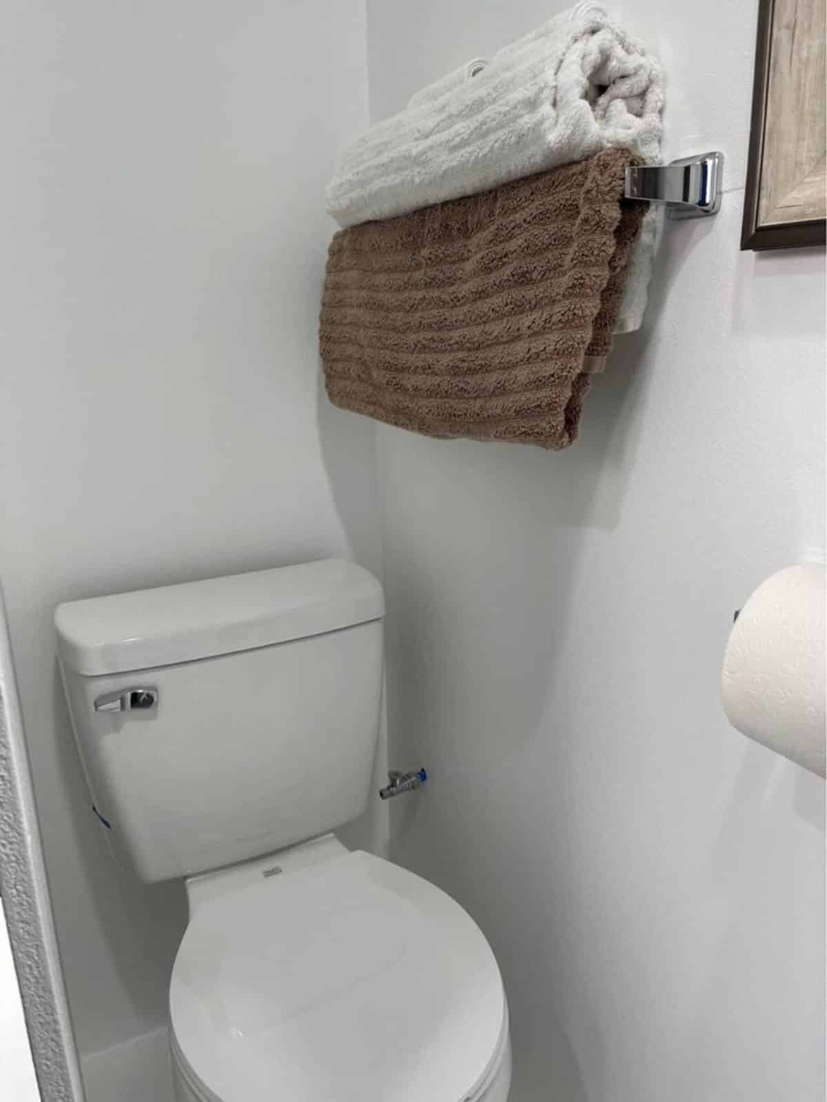 Standard toilet with towel in rack