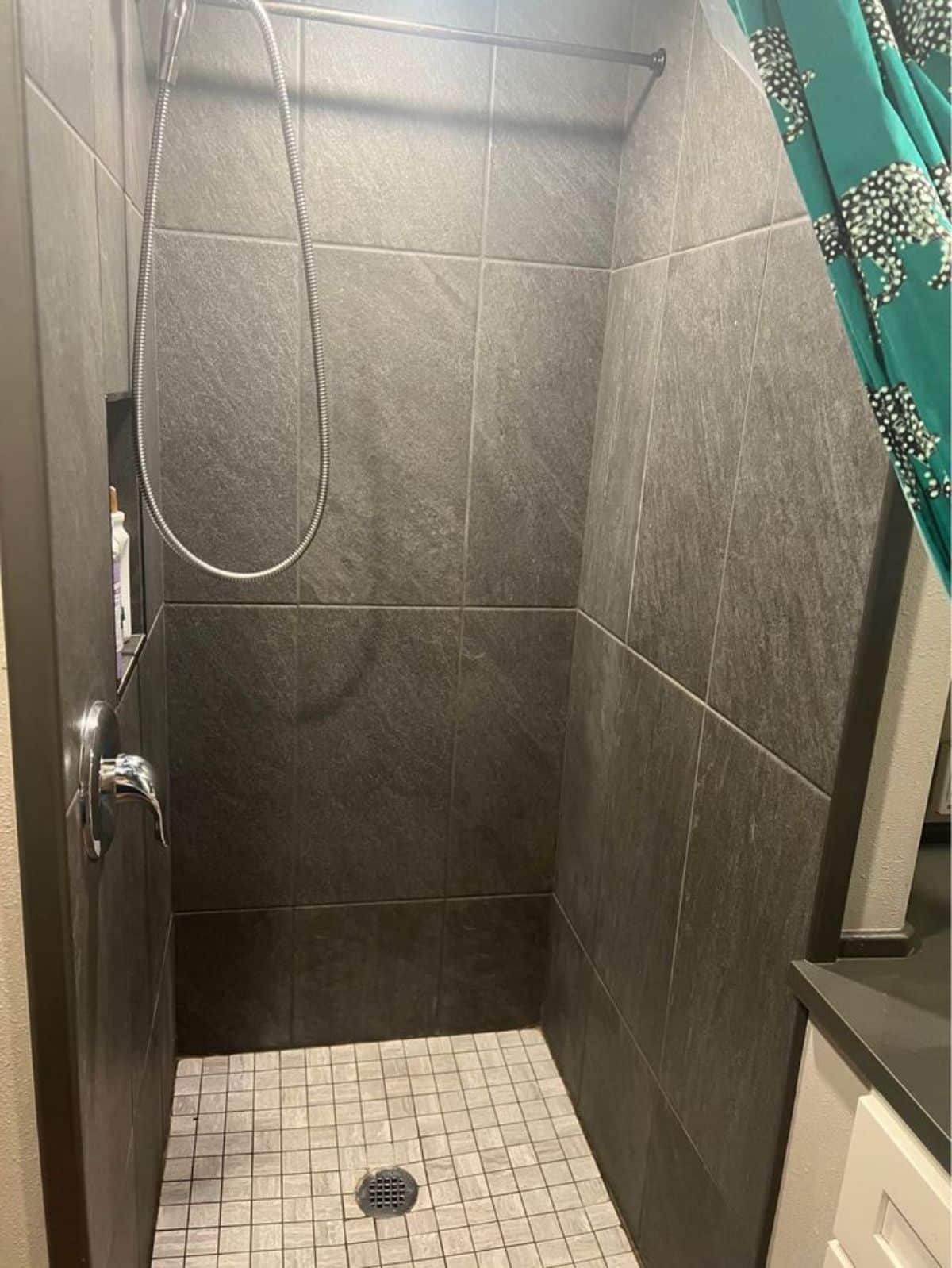 Fully tiled shower area of Tiny Home Has Two Bedrooms