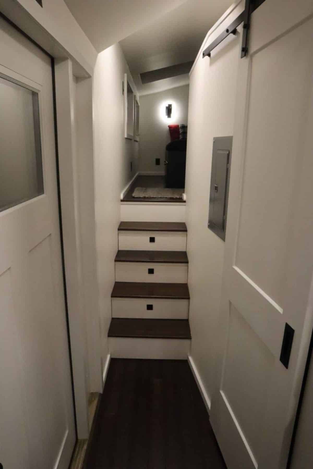 Stairs leading to the loft bedroom has storage underneath