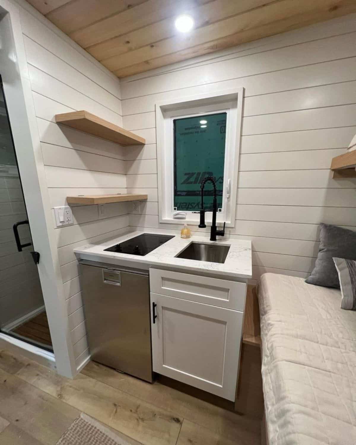 Stylish kitchen area of perfect tiny room on wheels