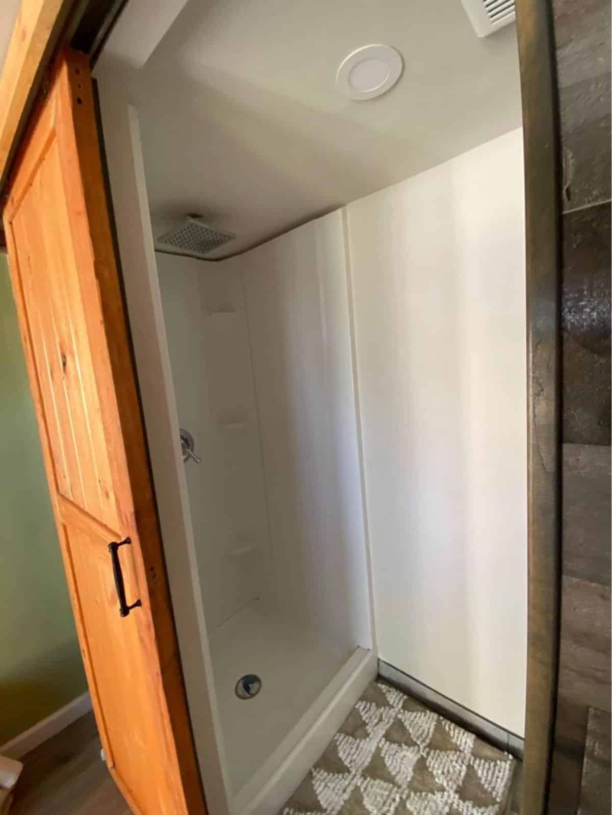 Bathroom of Tiny Home With Sleeping Loft has all the regular fitting plus separate shower area