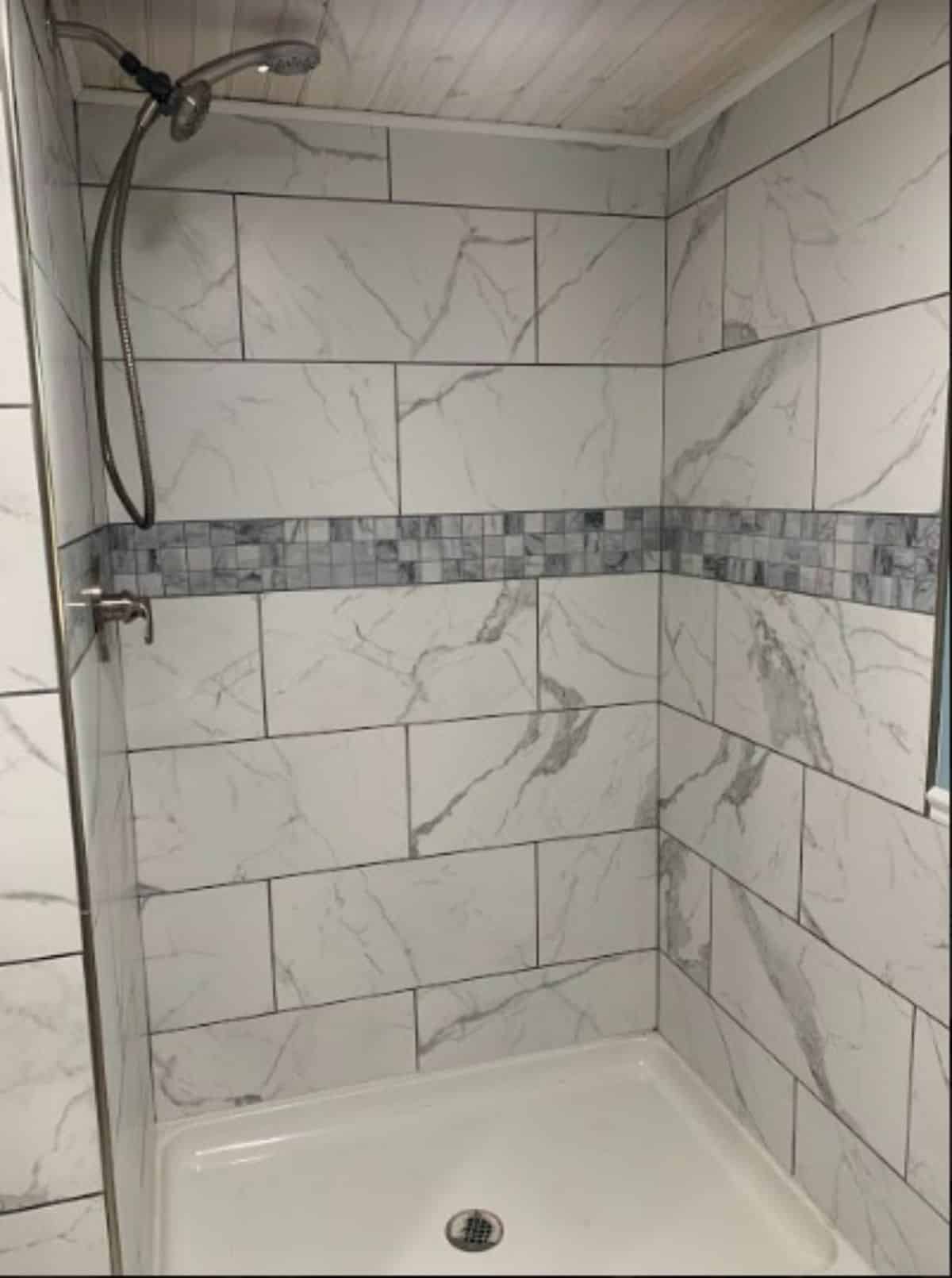 Stunning tiled bathroom with regular fittings