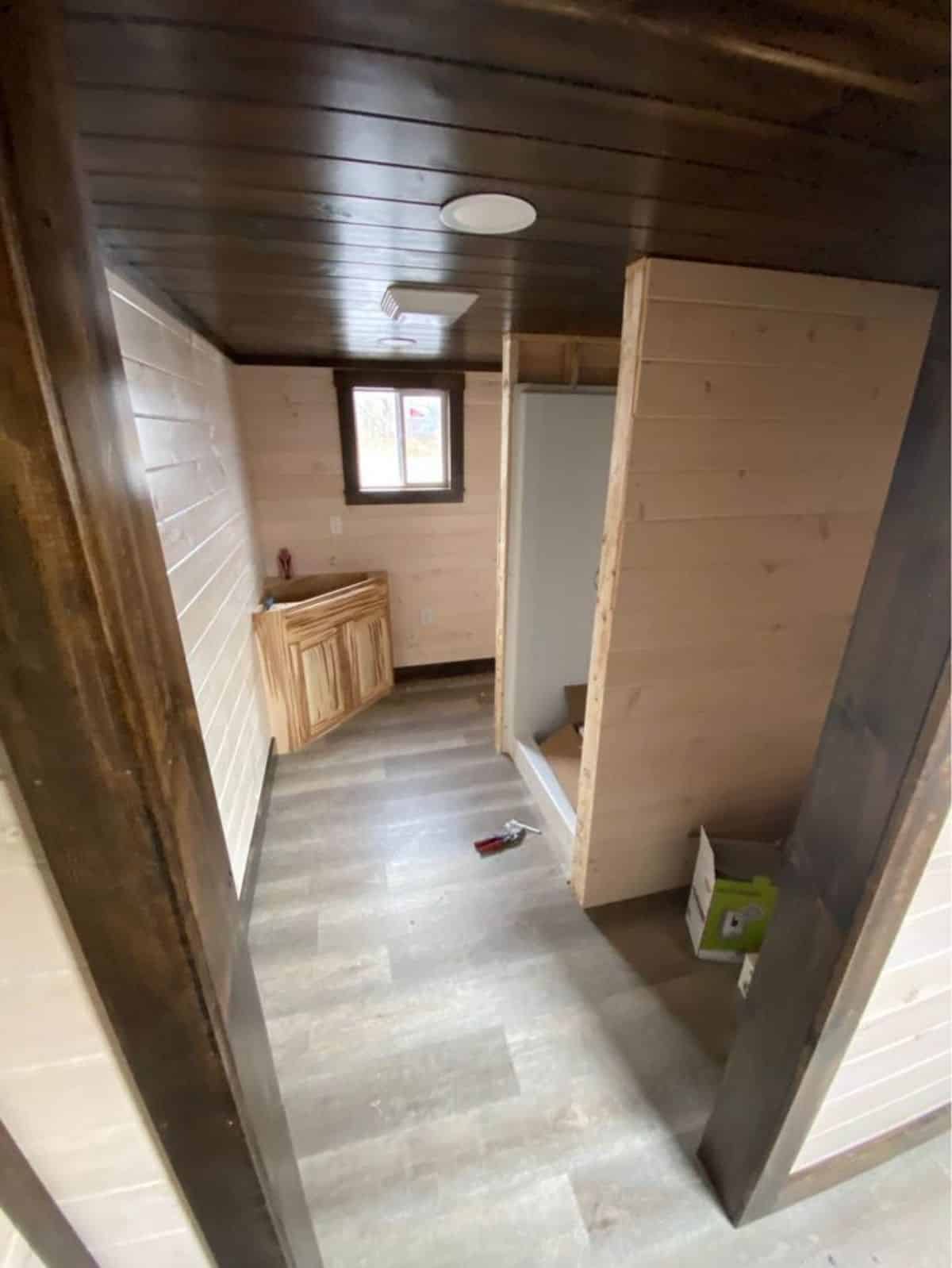 Bathroom of Custom Built Tiny Home has all the fittings plus walkout space