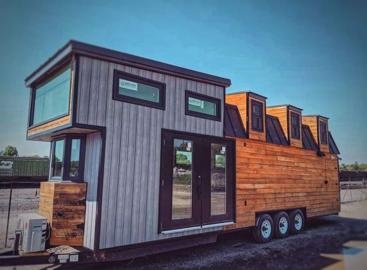gray and wood grain tiny home on wheels