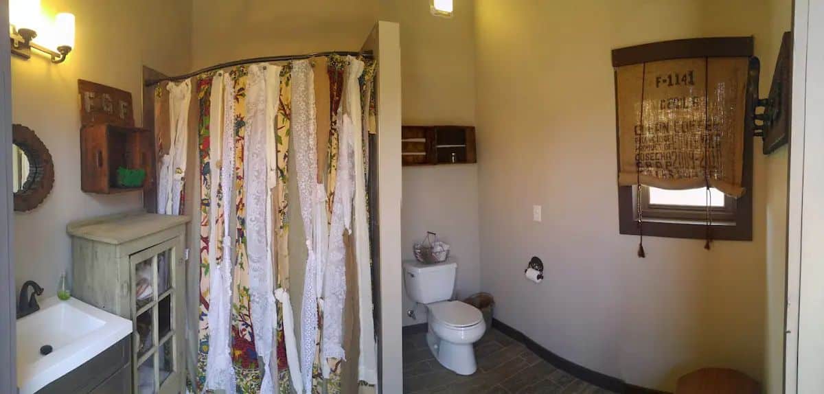 bathroom with shower on left and toilet in back right
