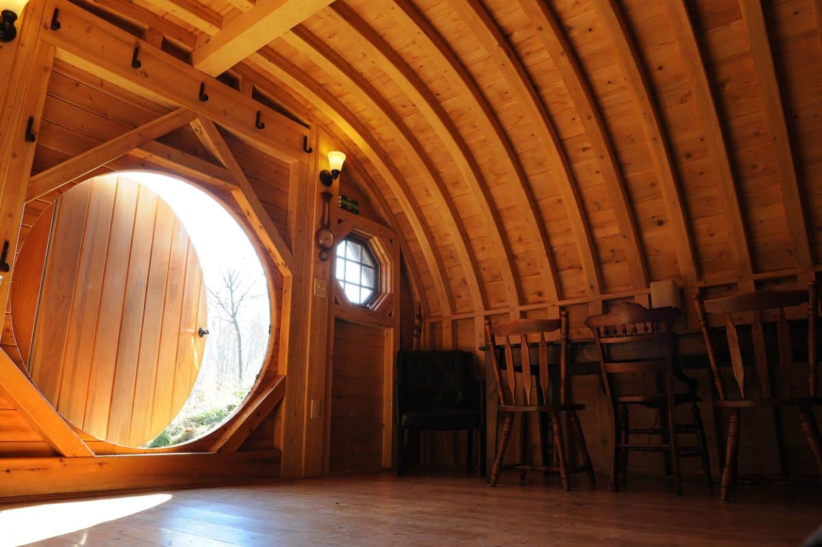 inside hobbit hut with round door