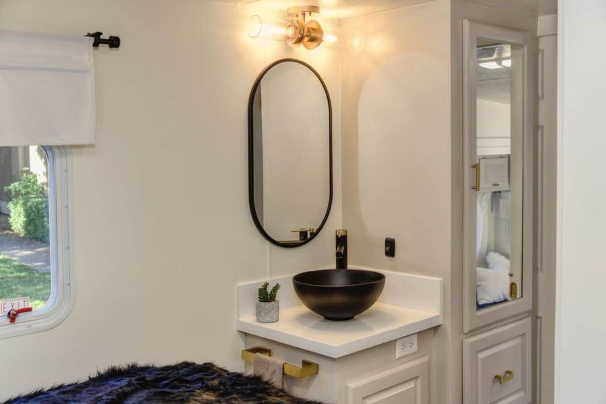 Beautiful vessel sink with vanity & mirror outside the bathroom