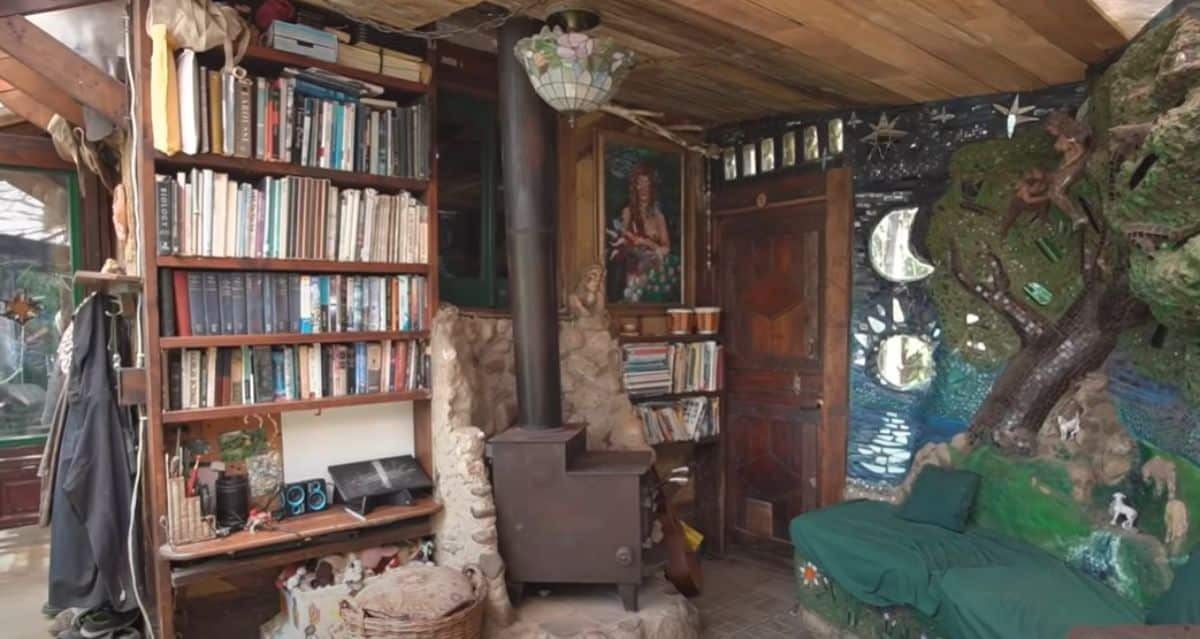 bookshelf on left behind wood stove