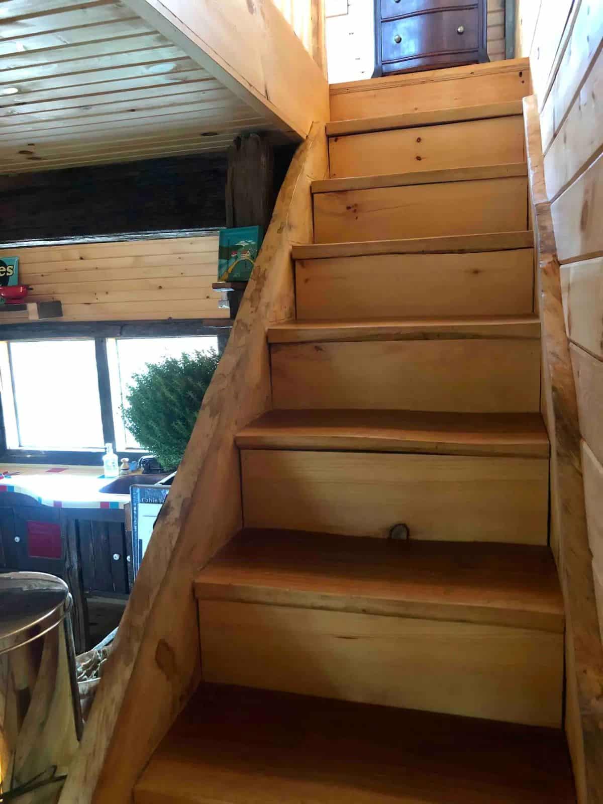 wood stairs to second level of cabin