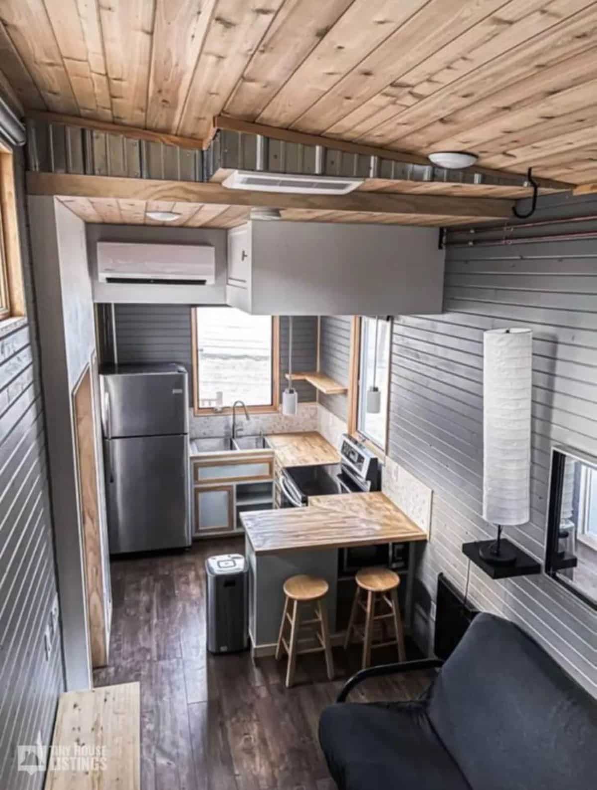 Extension to countertop of kitchen of Professionally Built 30' Tiny House is utilized as dining area