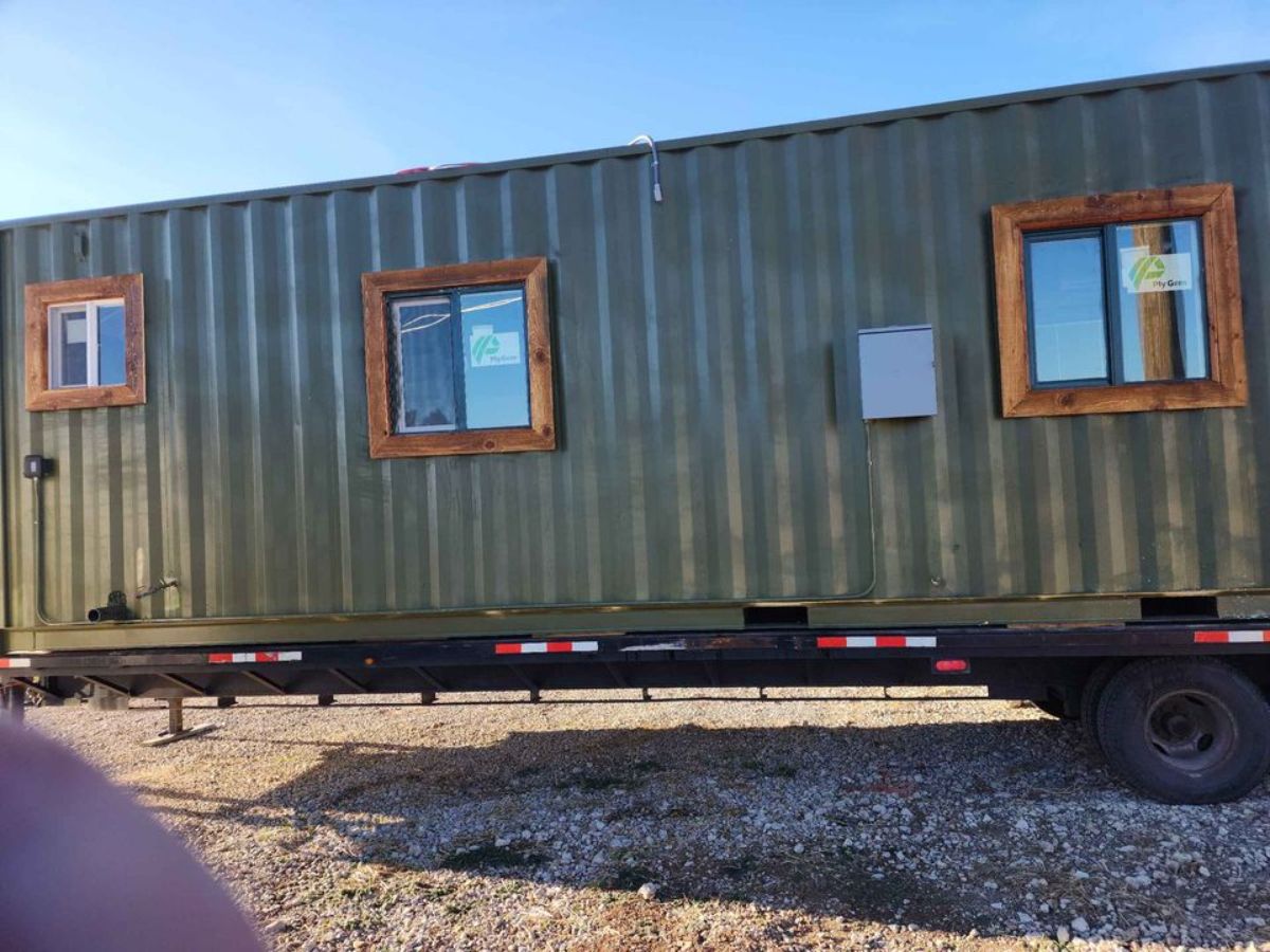 Stunning iron exterior of 40' shipping container home