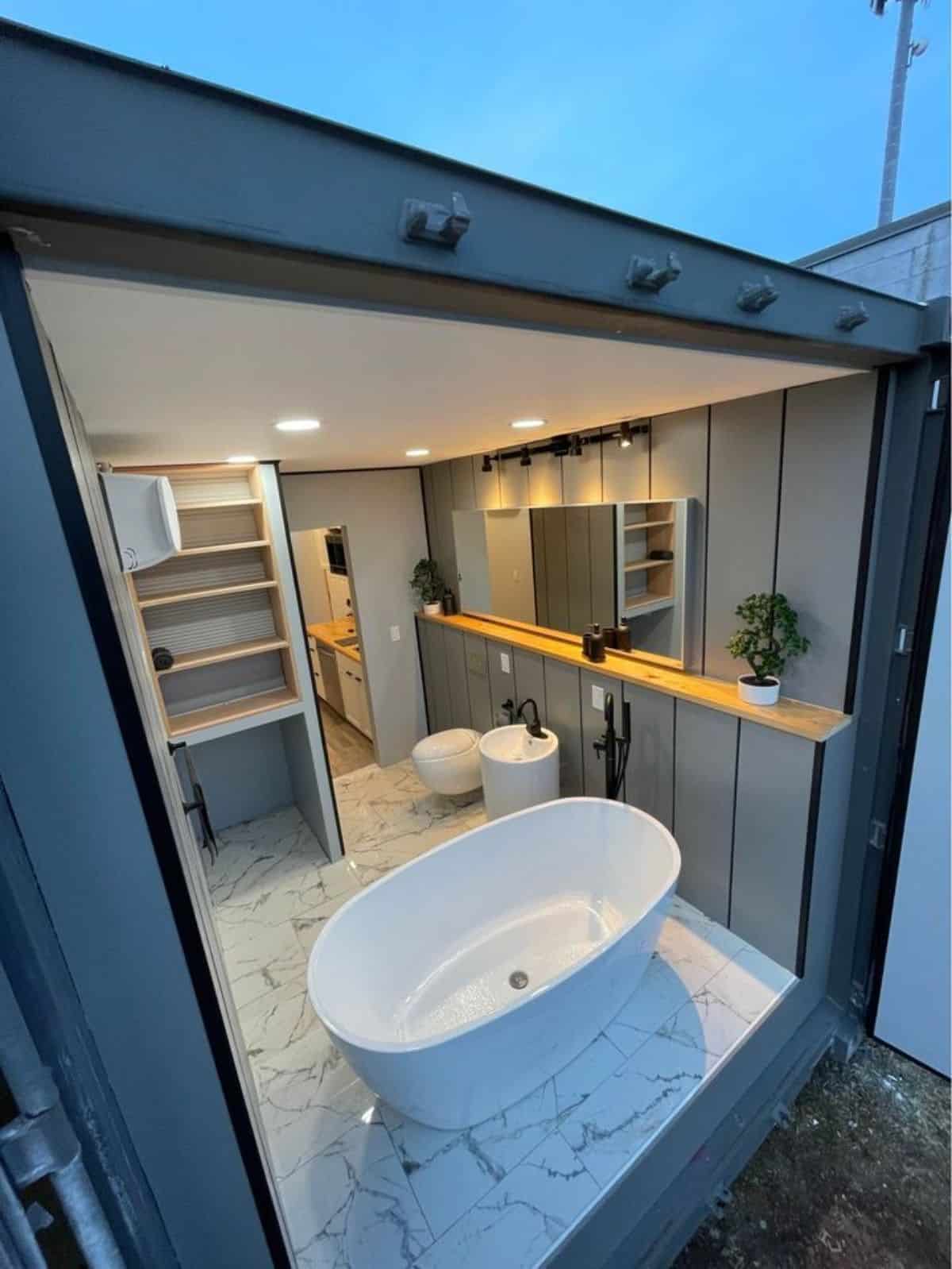 Huge bathroom has a standard fittings and huge bathtub