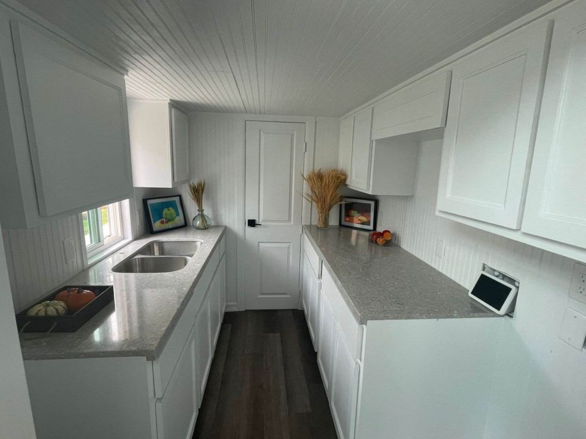 White interiors of Spacious Tiny Home With Two Lofts