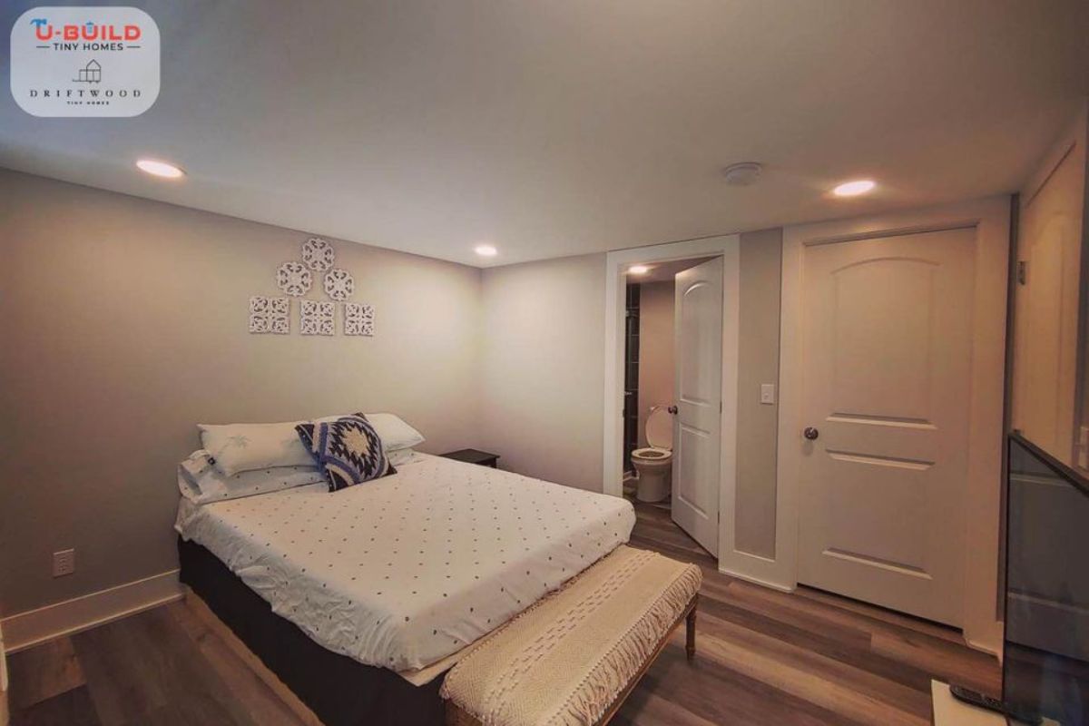 Main floor bedroom is actually a master bedroom with double bed has an ample space left