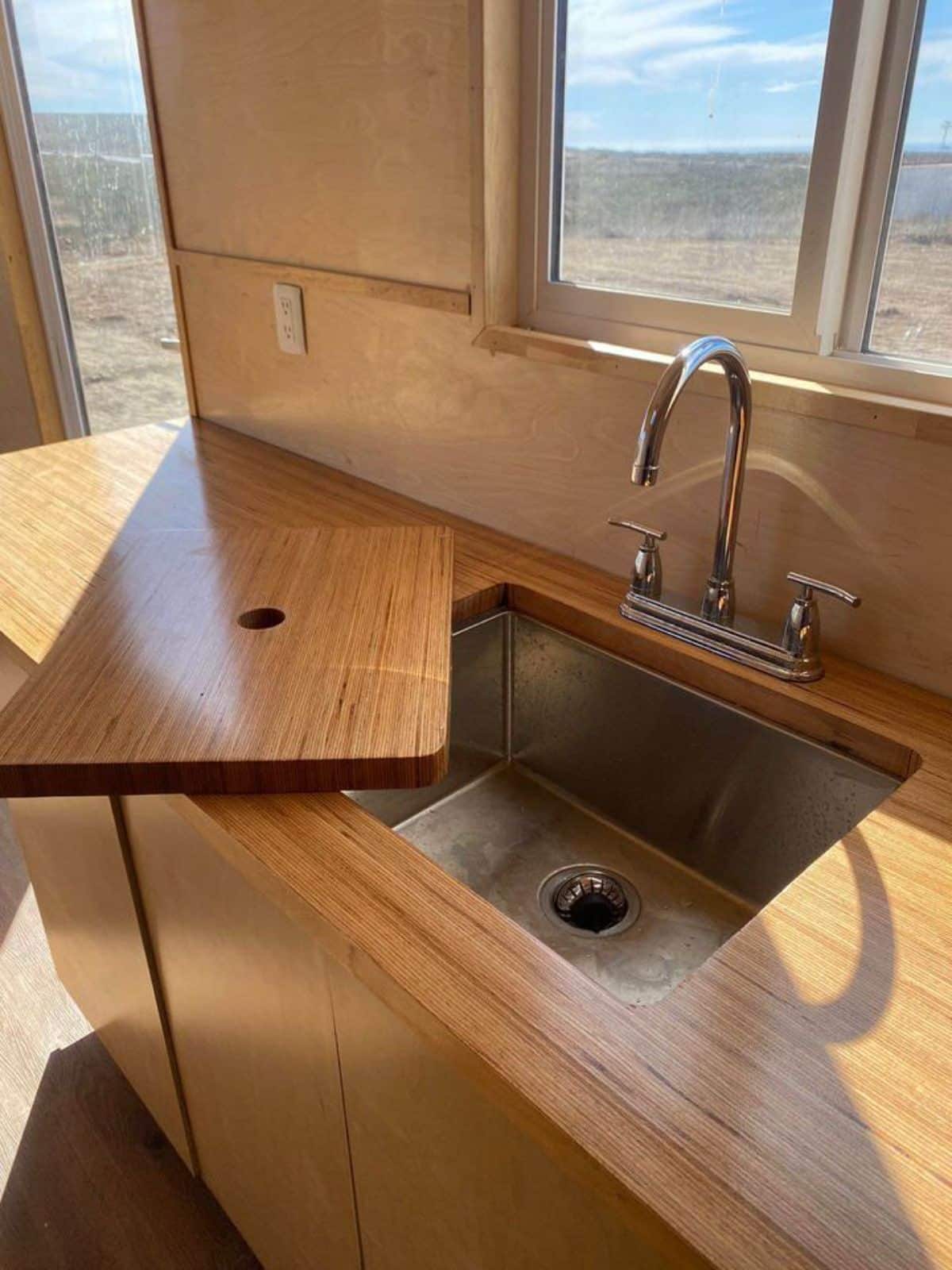 Sink with wooden cover lid